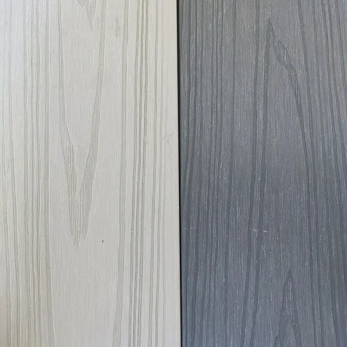 Dioco Tablón para terraza WPC Duratech - L x An x Es: 220 x 14,2 x 2,3 cm, Arena/Gris, 1 ud. - Primer plano de dos paneles de madera, uno en un tono claro y el otro en un gris más oscuro, mostrando la veta de la madera.