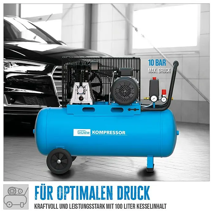 Güde Kompressor 580/10/100 H/ 400V - 3.000 W, Max. Druck: 10 bar, 100 l, Schmierung: Ölgeschmiert - Blauer Güde Kompressor mit 100L Tank und 10 bar Max. Druck, in einer Garage neben einem Auto.