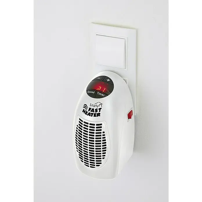 Heizlüfter Starlyf Fast Heater - 400 W, Weiß - Nahaufnahme einer weißen, an die Wand gesteckten Starlyf Fast Heater Heizung, die eine digitale Anzeige und ein Gitter hat.