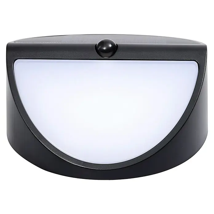 Lavida Solar-Außenwandleuchte - 5 W, L x B x H: 9,7 x 20 x 20 cm, Schwarz, IP54, 500 lm - Nahaufnahme einer solarbetriebenen Wandleuchte mit Bewegungssensor, die ein helles, weißes Licht ausstrahlt, ideal für den Außenbereich.