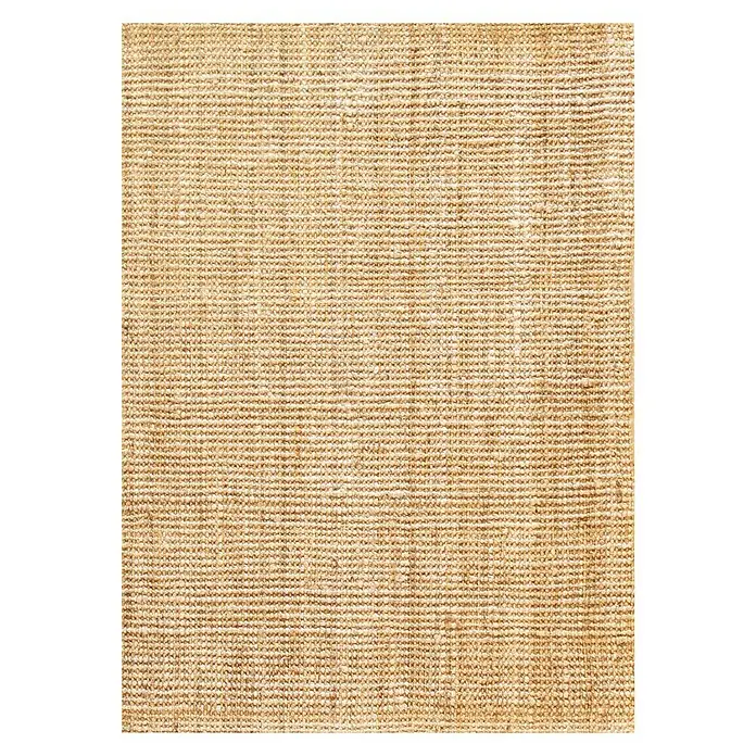 Alfombra de yute Siena - Beige, 110 x 60 cm - Primer plano de una alfombra de sisal beige, destacando su textura natural y un ambiente cálido y acogedor.