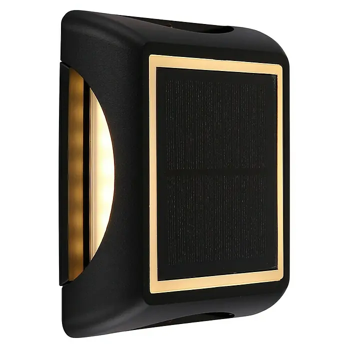 Globo Solar-Außenwandleuchte Wand und Boden - 1,2 W, L x B x H: 14 x 14 x 3,6 cm, IP65, 200 lm, Form: Quadratisch - Nahaufnahme einer modernen, würfelförmigen Solarleuchte mit schwarzem Gehäuse und goldfarbenen Akzenten, die ein warmes, einladendes Licht ausstrahlt.