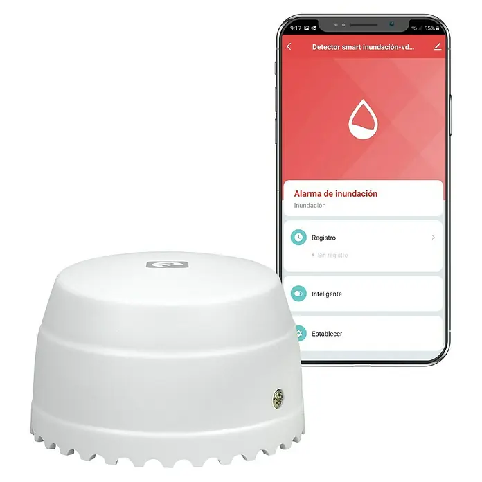 Garza Detector de agua inalámbrico Smart WiFi - Diámetro: 5,4 cm, Señal de alarma: 55 dB - Detector de inundación inteligente blanco junto a un smartphone con su aplicación de control.