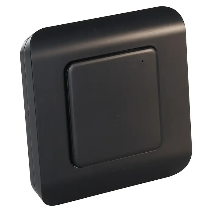 Chacon Interruptor inalámbrico Dio 1.0 - Alcance: 30 m, Negro - Imagen de un dispositivo negro cuadrado con esquinas redondeadas y un botón cuadrado. Adecuado para aplicaciones domóticas.