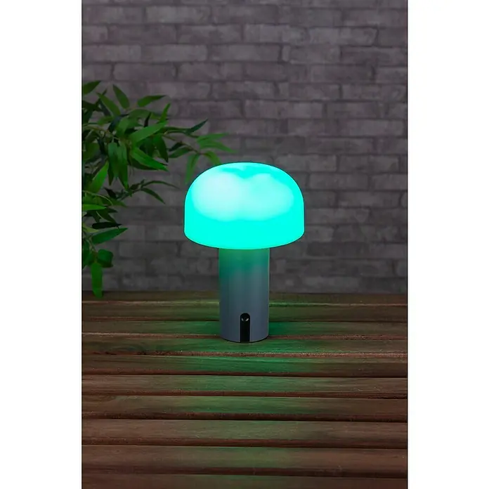 Starlux Akku-Tischleuchte Pilz - 1 W, L x B x H: 22 x 15 x 15 cm, RGBW, Grau - Diese Aufnahme zeigt eine moderne, pilzförmige Tischlampe, die ein sanftes, aquamarinblaues Licht ausstrahlt und so eine gemütliche Atmosphäre schafft.