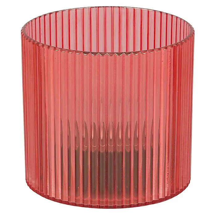 BAUHAUS Solar-Dekoleuchte Teelicht - 0,6 W, Rot, IP44 - Nahaufnahme eines geriffelten zylindrischen Behälters aus rosafarbenem Kunststoff, der sich ideal als stilvolle Vase oder als dekoratives Aufbewahrungselement eignet.