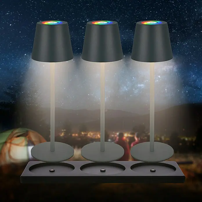 Brilo Akku-Tischleuchte Cilano - L x B x H: 15 x 42 x 36 cm, RGBW, 3 Stk., Schwarz - Drei stilvolle kabellose LED-Tischlampen mit Farbwechsel-Funktion auf einer schwarzen Ladestation für den Innen- und Außenbereich.