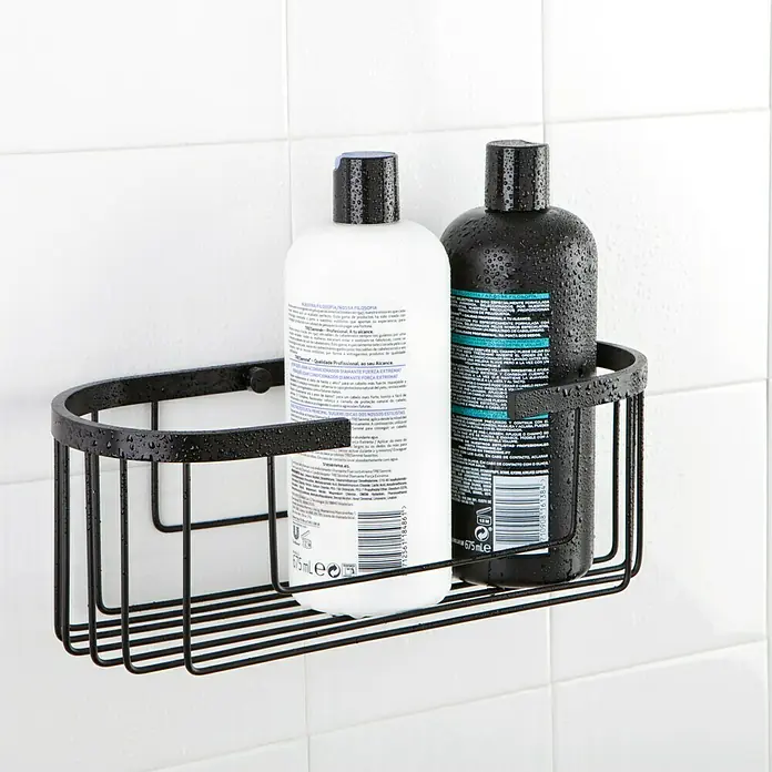 Tatay Aluminium Cesta de baño oval - 12 x 30 x 11,5 cm, Negro - Estante de ducha de alambre metálico negro con dos frascos de champú sobre azulejos blancos.