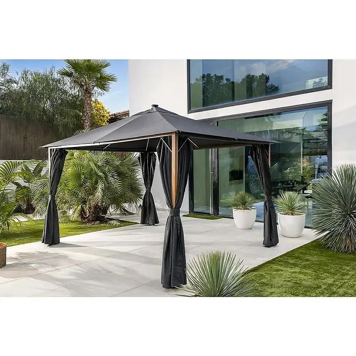 Sunfun Carpa con laterales Mauricio - An x Pr: 299 x 399 cm, Color del techo: Antracita - Carpa de jardín moderna con techo negro y cortinas en un patio, rodeada de plantas. La carpa ofrece un espacio exterior elegante y sombreado.