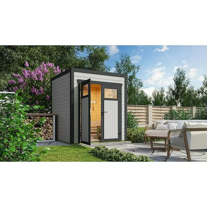 Weka Gerätehaus Batu Nika 1 - Außenmaß inkl. Dachüberstand (B x T): 200 x 207,4 cm, Holz, Hellgrau - Moderne Gartensauna/Schuppen in Dunkel- und Hellgrau, neben Holzstapel.