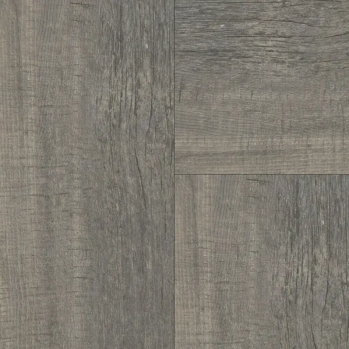 Vinylbodenmuster Isocore Inside Corse - 280 x 120 x 8 mm, Fischgrät - Nahaufnahme von strukturierten, grauen Holzdielen, die ein rustikales und modernes Bodendesign zeigen.\n