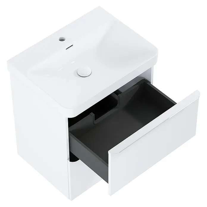 Riva Beauty 2.0 Waschtischunterschrank - B x T x H: 58,5 x 43,7 x 63,5 cm, Weiß Matt - Ein weißer Waschtischunterschrank mit einer Schublade, die teilweise geöffnet ist, um den grauen Innenraum zu zeigen.