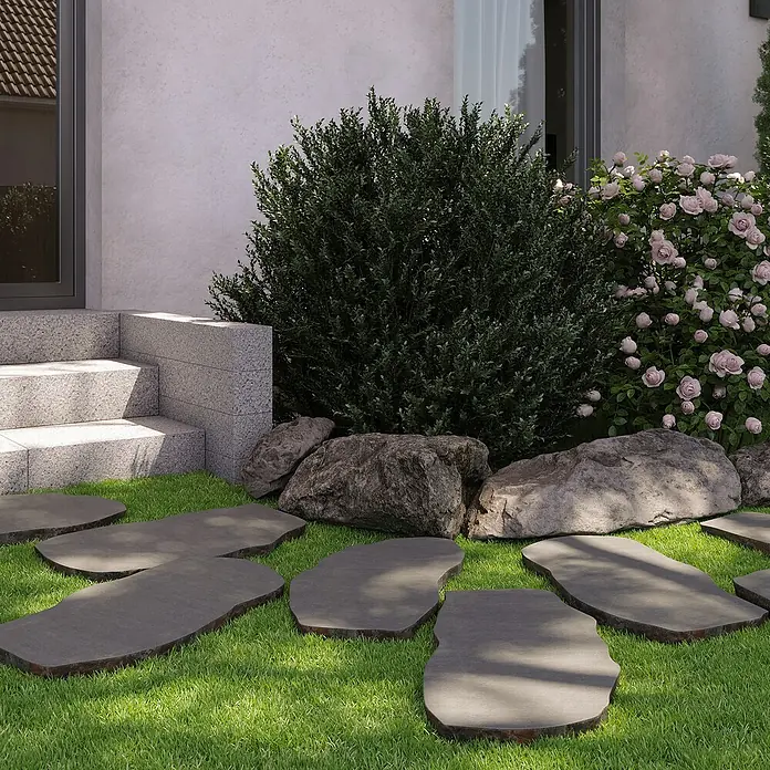 Trittstein - 60 x 30 x 3 cm, Anthrazit, Basalt - Die Steinplatten fügen sich elegant in den Rasen ein und führen durch den Garten, umgeben von üppigem Grün und dekorativen Felsen.
