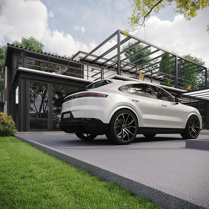 Rasenkante G 654 - 100 x 20 x 5 cm, Anthrazit, Granit - Elegantes weißes Porsche Cayenne Coupé vor modernem Haus. Das luxuriöse SUV vereint sportliches Design mit Komfort für höchste Ansprüche.