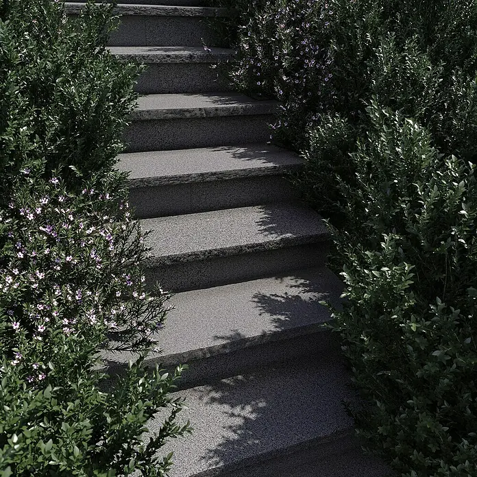 Mauerabdeckplatte G 654 - Anthrazit, 100 x 32 x 4 cm - Steintreppe umrahmt von üppigem Grün und zarten lila Blüten. Die Treppe lädt zum Erklimmen ein.
