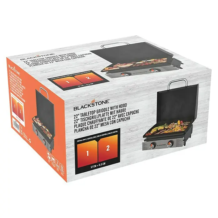 Blackstone Plancha Grill 22" - Superficie de la parrilla (An x Pr): 57 x 41,5 cm, Negro, Número de quemadores: 2 ud. - Imagen de la plancha de mesa Blackstone de 22 pulgadas con tapa en su embalaje.