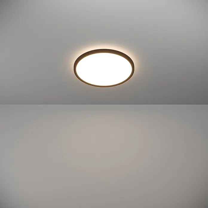 Eglo LED-Deckenleuchte Rovito - 13,9 W, Ø x H: 30 x 3 cm, Schwarz, Warmweiß - Nahaufnahme einer runden Deckenleuchte mit warmweißem Licht, die in einem modernen Raum für eine angenehme Atmosphäre sorgt.