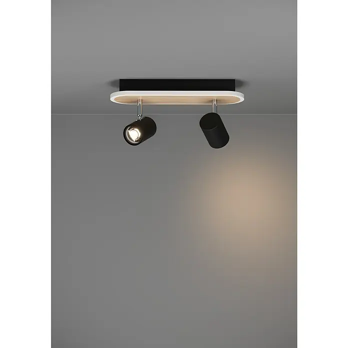 Eglo LED-Deckenstrahler Rimbocchi - 12 W, L x B x H: 34 x 10 x 15 cm, Schwarz, Holz, Warmweiß - Schwarze Deckenleuchte mit zwei schwenkbaren Strahlern, einer leuchtet, auf weiß-holzfarbenem ovalen Sockel.