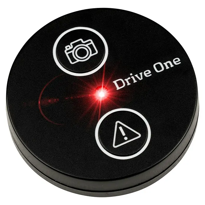 Needit Drive One - Mit Batterien - Rundes schwarzes Drive One Gerät mit weißen Kamera- und Warnsymbolen, das ein hellrotes, sternförmiges aktives Licht zeigt.