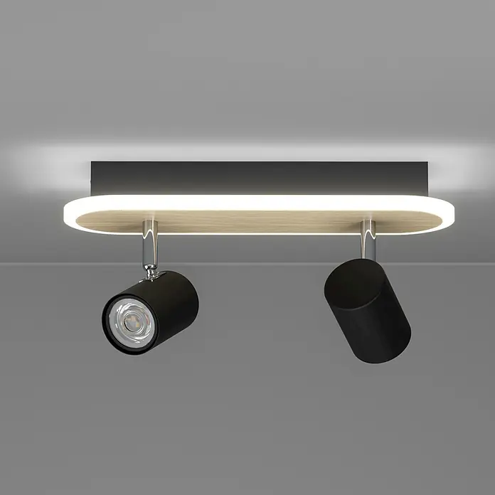 Eglo LED-Deckenstrahler Rimbocchi - 12 W, L x B x H: 34 x 10 x 15 cm, Schwarz, Holz, Warmweiß - Deckenleuchte mit schwarzen Strahlern, ovaler Holzoptik-Basis und integriertem LED-Streifen. Montiert auf dunkelgrauer Platte.