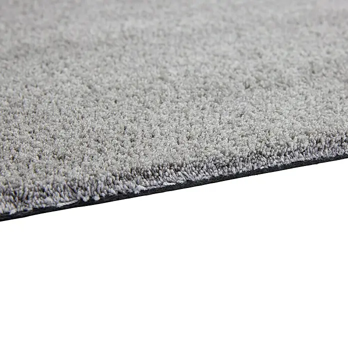 Fußmatte Moon - Hellgrau, 100 x 60 cm, 100 % Polyester - Nahaufnahme eines grauen Teppichs, der seine weiche Textur und dichte Fasern zeigt. Perfekt für Komfort und Stil in jedem Raum.