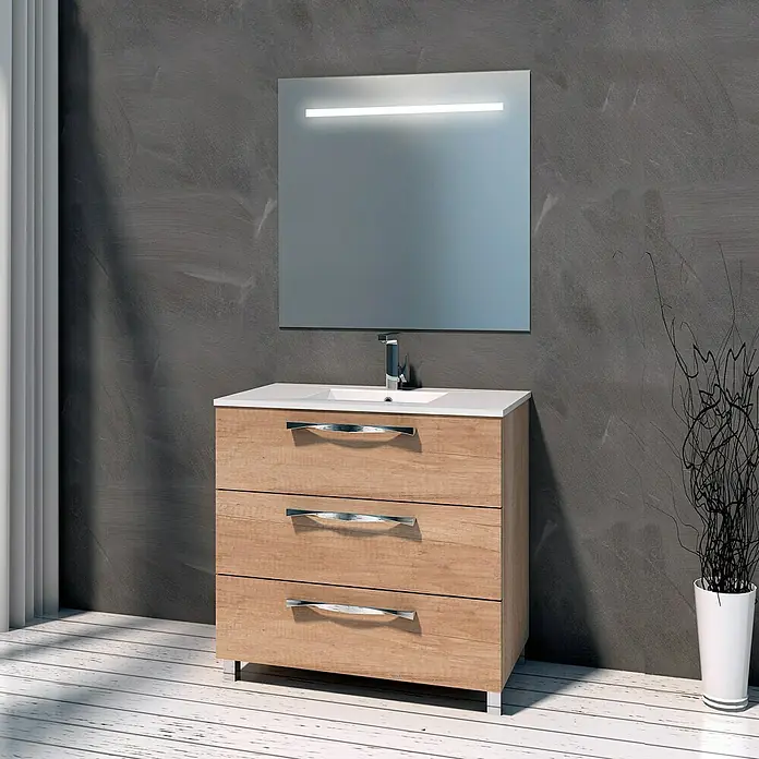 Artysan Mueble bajo de lavabo Tree - 46 x 100 x 85 cm, Nature - Un tocador moderno con tres cajones de aspecto de madera, un lavabo sobre encimera blanco y un espejo iluminado contra una pared gris.