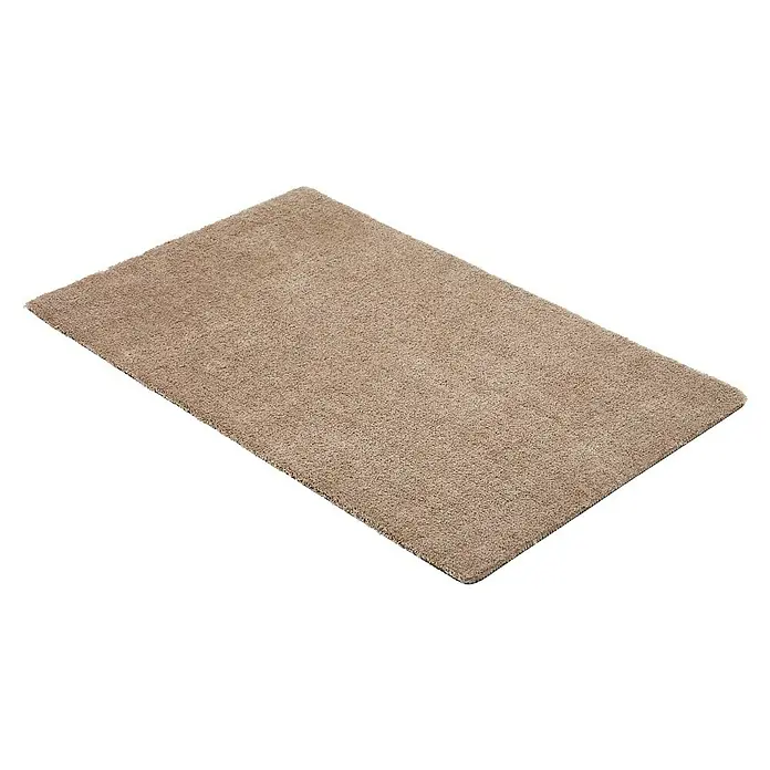 Fußmatte Moon - Taupe, 100 x 60 cm, 100 % Polyester - Nahaufnahme eines beigen Teppichs mit weicher Textur, ideal für eine gemütliche Atmosphäre in jedem Raum.