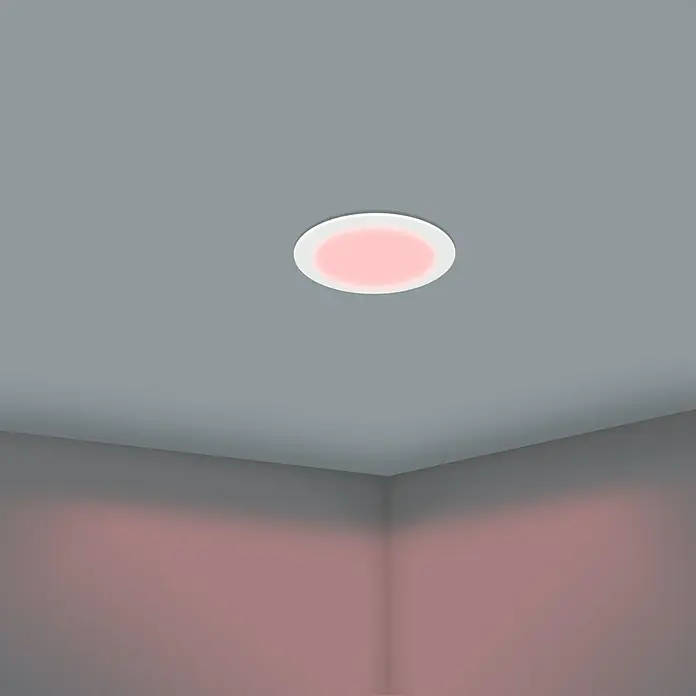 Eglo LED-Einbauleuchten-Set rund ABIUL - 3,2 W, Ø x H: 8,6 x 4 cm, Weiß, RGBW - Deckenleuchte mit rosa Licht in einem grauen Raum. Die Lampe sorgt für eine angenehme und warme Beleuchtung des Raumes.