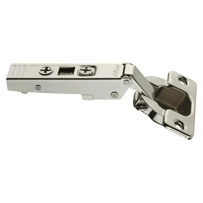 Suki Bisagra de cazoleta - Tope de esquina, Diámetro cazoleta: 35 mm, Ángulo de apertura: 110 ° - Primer plano de una bisagra metálica Blum, utilizada para muebles y armarios. Está aislada sobre un fondo blanco.