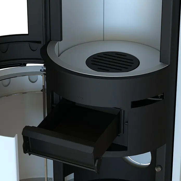 Kaminofen Xena 310 - 7,1 kW - 7,6 kW, Raumheizvermögen: 200 m³, Material Verkleidung: Stahl, Weiß - Schwarzes Metall-Innenleben eines Ofens mit ausgezogener Ascheschublade und rundem Rost.