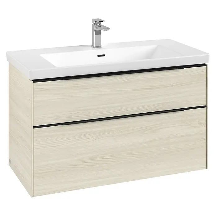 Villeroy & Boch Subway 3.0 Waschbeckenunterschrank - White Oak, Anzahl Schubladen: 2 Stk., Farbe Griff: Volcano Black, B x T x H: 97,3 x 47,8 x 57,6 cm - Badezimmerschrank mit weißem Keramikwaschbecken, Chromarmatur und hellem Holzschrank mit schwarzen Griffleisten.