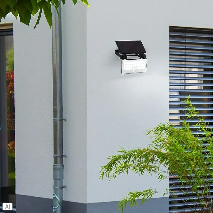 Brilliant Solar-Außenwandleuchte Luton - 6 W, L x B x H: 19,1 x 19,4 x 4,3 cm, Schwarz, IP65, 1.000 lm - Schwarzer Solar-LED-Strahler beleuchtet aktiv, mit separatem Solarpanel zum Laden.