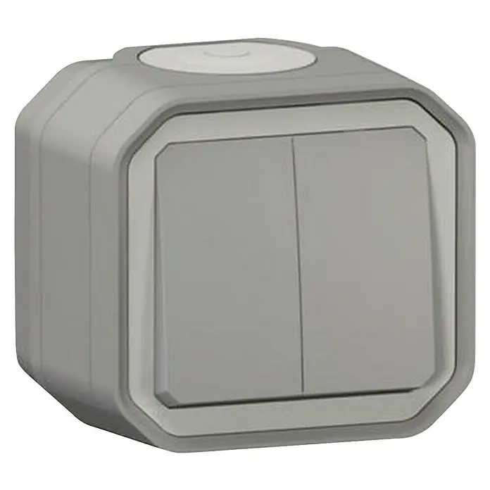 Legrand Feuchtraum-Wechselschalter Plexo New 069715L - Grau, Aufputzmontage, IP55 - Nahaufnahme eines grauen Doppelwippschalters, der ein modernes Design und Funktionalität für die Steuerung von Licht oder anderen Geräten bietet.