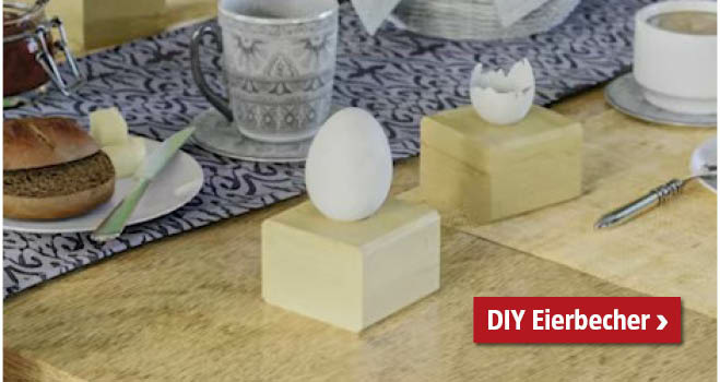 Selbstgemachter Eierbecher aus Holzwürfel mit Ei