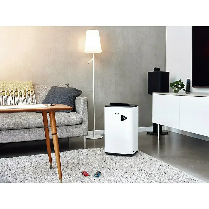 Woods Elektro-Luftentfeuchter MDX 20P - 360 W, Entfeuchtungsleistung: 20 l/Tag, Weiß - Weißer Wood's Luftentfeuchter mit digitaler Anzeige '54' auf einem Wohnzimmerteppich.