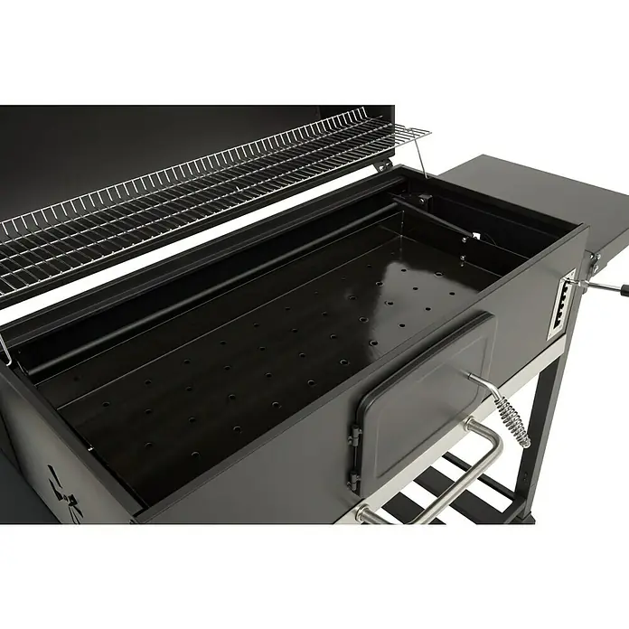 Kingstone KMS Barbacoa de carbón Black Angus Maxi - Superficie de la parrilla (An x Pr): 92 x 43 cm, Negro - Primer plano de una parrilla de carbón abierta con rejilla y bandeja de carbón perforada.