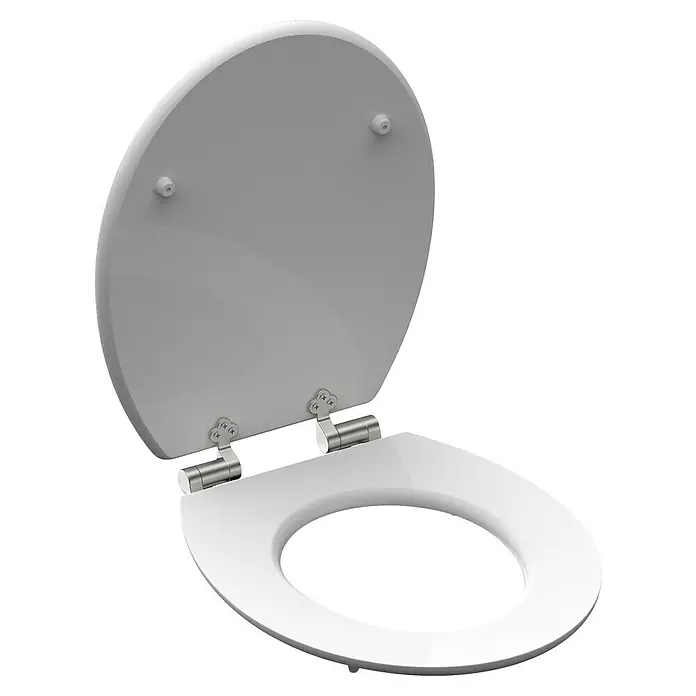 Schütte WC-Sitz Polar Lights - MDF, Blau/Orange, Mit Absenkautomatik - Nahaufnahme eines weißen WC-Sitzes mit Deckel, der leicht geöffnet ist und die glänzende Oberfläche und die Scharnierdetails zeigt.
