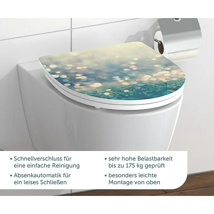 Schütte WC-Sitz Magic Light - Duroplast, Bunt, Mit Absenkautomatik - Nahaufnahme eines stilvollen WC-Sitzes mit glitzerndem Bokeh-Muster, der Komfort und Ästhetik im Badezimmer vereint.