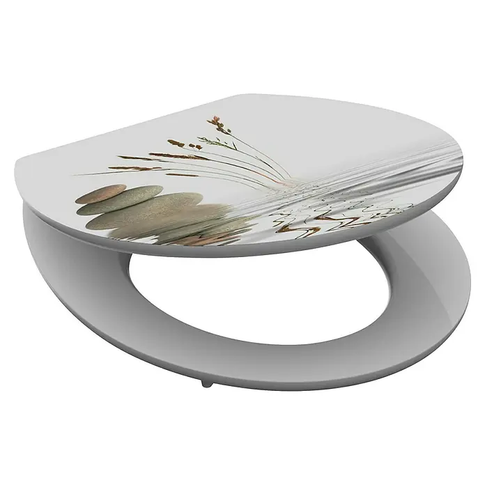 Schütte Tapa de WC Schütte - MDF, Balance, Con caída amortiguada - Asiento de inodoro con base gris y tapa blanca con estampado de piedras apiladas y cañas con efecto de agua.