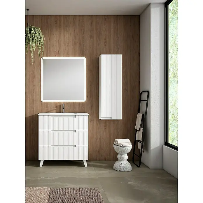Mueble bajo de lavabo Claire - L x An x Al: 45 x 80 x 81 cm, Blanco, 1 seno, empotrado, salida central, Número de cajones: 3 ud. - Mueble de baño blanco acanalado con lavabo integrado y espejo retroiluminado, junto a un armario alto a juego.