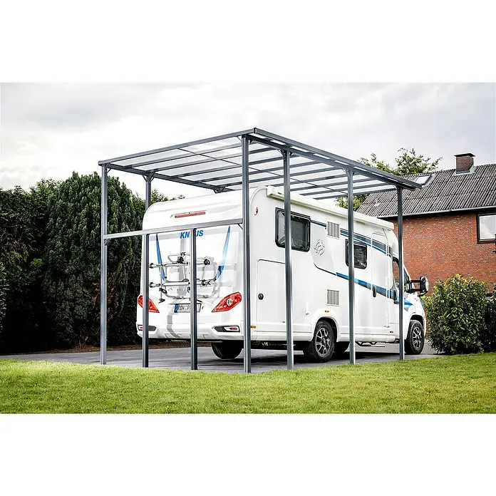 DWS Outdoor Carport Premium XL - Außenmaß inkl. Dachüberstand (B x T): 3,31 x 5,41 m, Anthrazit, Carport geeignet für: Caravans - Graues Metallcarport mit transluzentem Dach über einem weißen Wohnmobil.