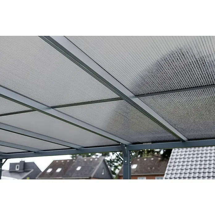 DWS Outdoor Carport Premium XL - Außenmaß inkl. Dachüberstand (B x T): 3,31 x 5,41 m, Anthrazit, Carport geeignet für: Caravans - Graues Metallgestell trägt lichtdurchlässige Wellplatten aus Polycarbonat als Überdachung.