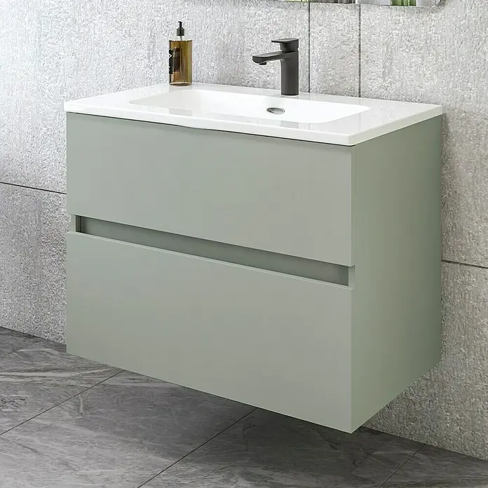 Disbain Conjunto de mueble de baño Kuntur - Ancho: 80 cm, Verde té, Mate - Un moderno tocador suspendido en verde, con lavabo blanco y grifo negro, sobre un fondo de pared gris.