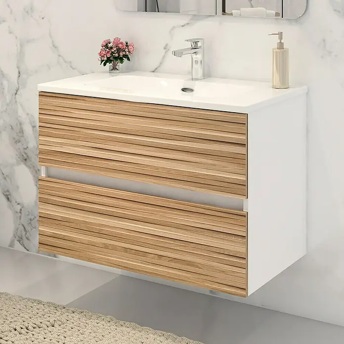 Disbain Conjunto de mueble de baño Vega - Ancho: 80 cm, Blanco/Bambú, 2 pzs. - Primer plano de un moderno tocador de baño con cajones de madera, encimera blanca y grifo sobre una pared de mármol.