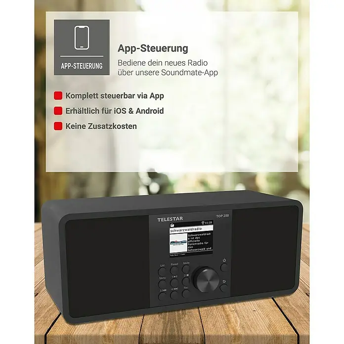 Telestar Internetradio Top 250 - L x B x H: 13 x 27,6 x 11,8 cm, Schwarz - Abbildung eines grauen Telestar TOP 250 Radios mit App-Steuerung auf einem Holztisch. Das Radio hat ein Display und mehrere Bedienknöpfe.