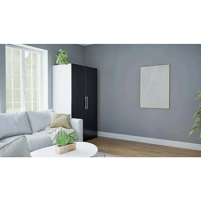 Respekta Schrankküche Peter - Breite: 104 cm, Schwarz/Weiß, Mit Duo-Kochmulde und Mikrowelle - Ein stilvolles Wohnzimmer mit einem eleganten weißen Sofa, einem modernen Schrank und einem abstrakten Kunstwerk an der Wand.