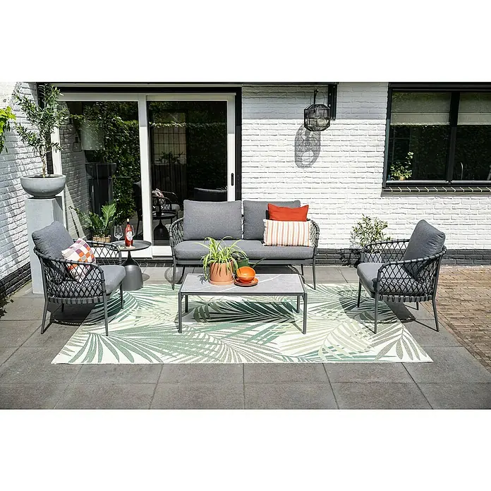 Garden Impressions Loungemöbel-Set Tropea - 4 -tlg., Aluminium, Grau/Schwarz - Graue Outdoor-Sitzgruppe mit passenden Tischen und einem grün-weiß gemusterten Teppich auf einer Terrasse.
