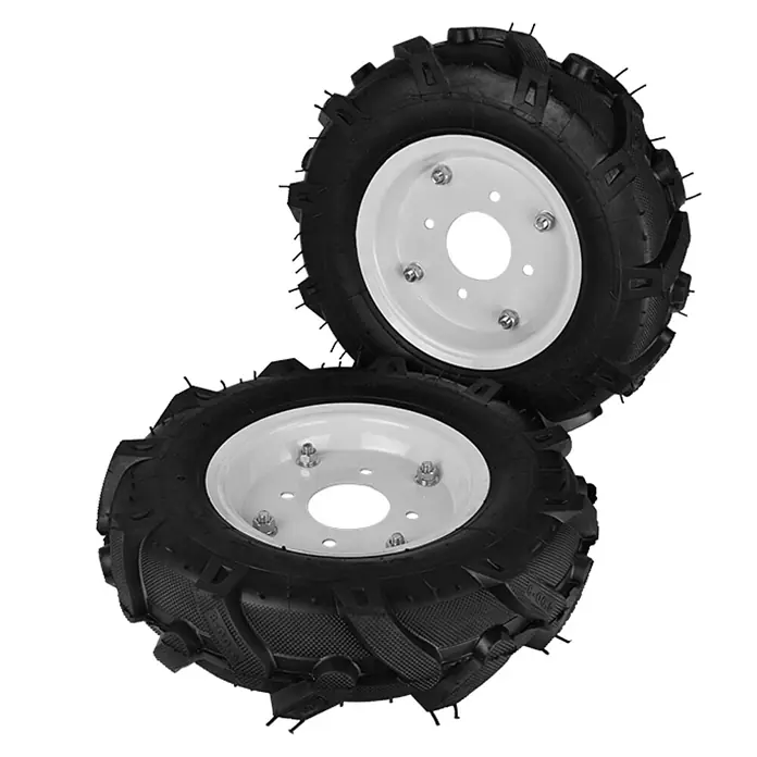 Könner & Söhnen Luftrad KS RW40 - 2 Stk., Passend für: Bodenhacke KS 7HP-950A, KS 7HP-950S, KS 7HP-1050G und KS 9HP-1350G-3 - Das Bild zeigt zwei Reifen mit weißen Felgen und grobem Profil, die für landwirtschaftliche Maschinen oder Gartenfräsen geeignet sind.
