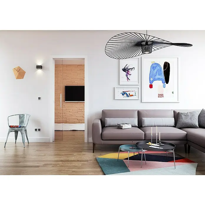 Entravia Kabelkanal für CW100 - Passend für: Entravia Simple-Pocket Schiebetürsystem - Elegantes Wohnzimmer mit modernem Sofa, stilvoller Beleuchtung und Kunstwerken. Das Sofa ist ein echter Hingucker im Raum.