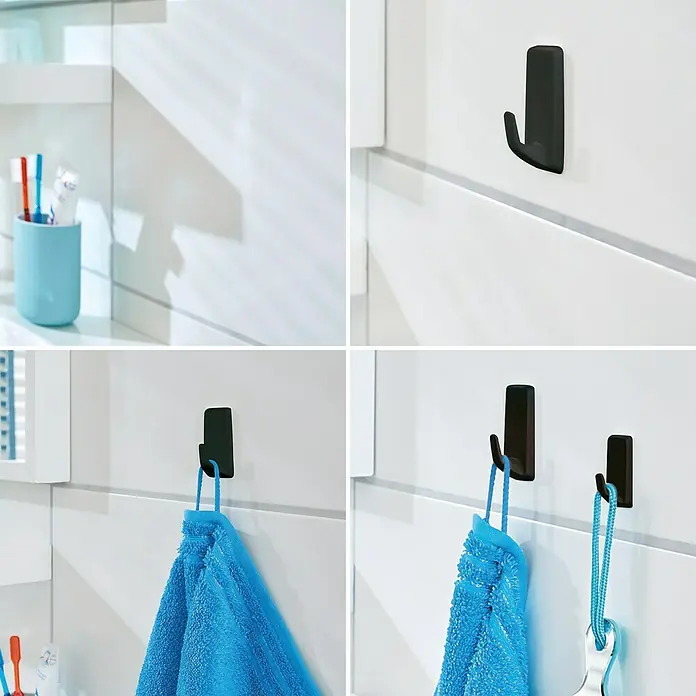 Tesa Powerstrips Selbstklebehaken - Eckig, Größe: L, Schwarz, 2 Stk. - Schwarze Command Haken an einer weißen Wand, einige mit Handtüchern oder einem Schlüsselanhänger behangen.